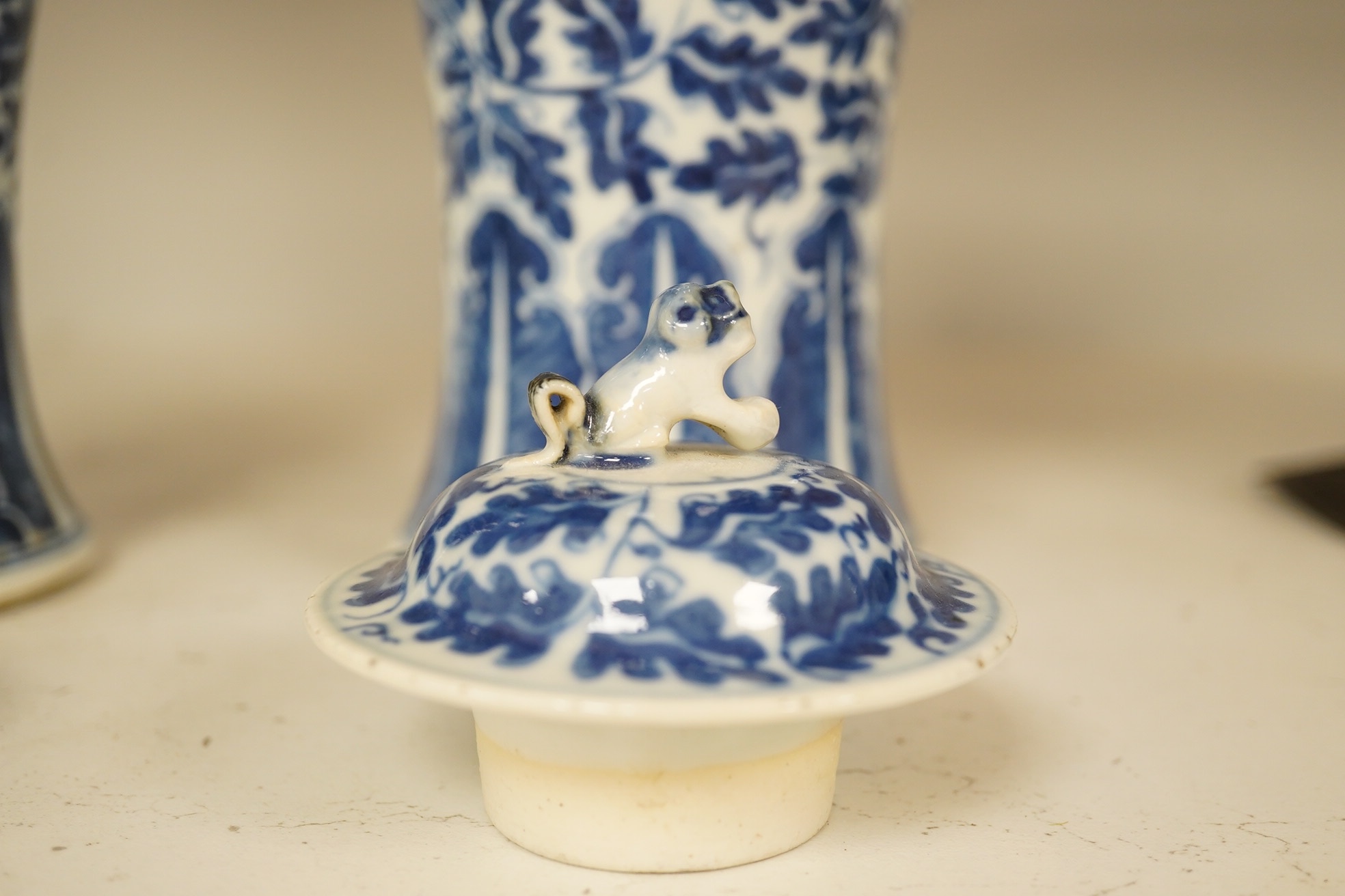 A pair of Chinese blue and white lotus decorated baluster vases and covers, late 19th century